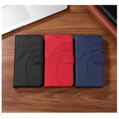 etui telephone noir rouge bleu sur table bois
